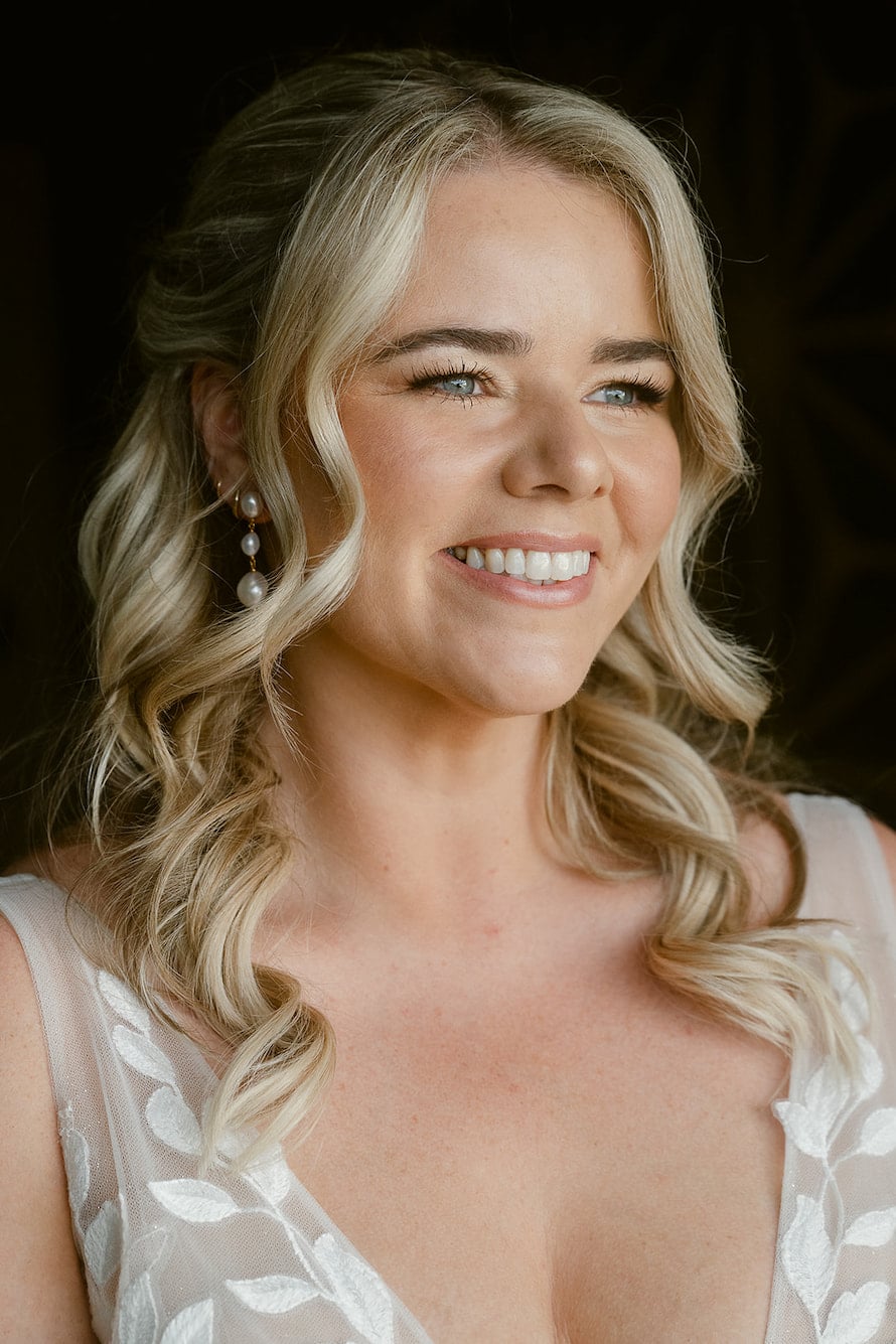 Smiling bride in Split with soft natural bridal makeup, glowing skin and elegant wedding beauty by Kate Ramic