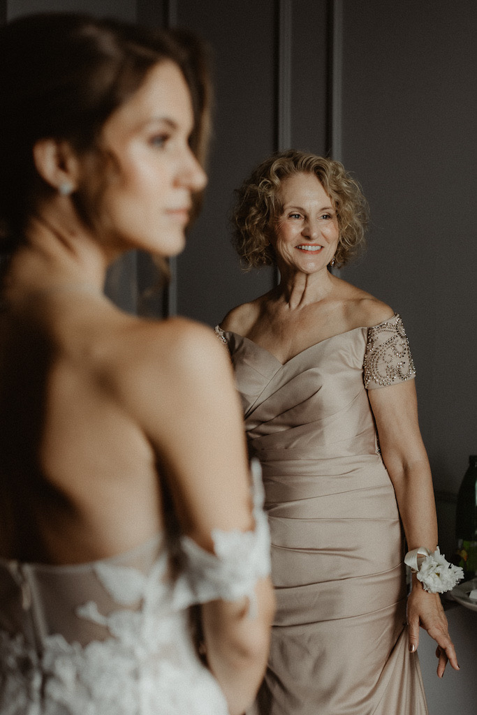 Mother of the bride smiling on daughter’s wedding day in Dubrovnik, wearing a powder-coloured dress and glowing with happiness.